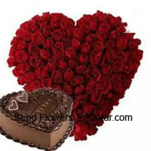 Heart Shaped Arrangement Of 100 Red Roses Along With 1 Kg Heart Shaped Chocolate Cake