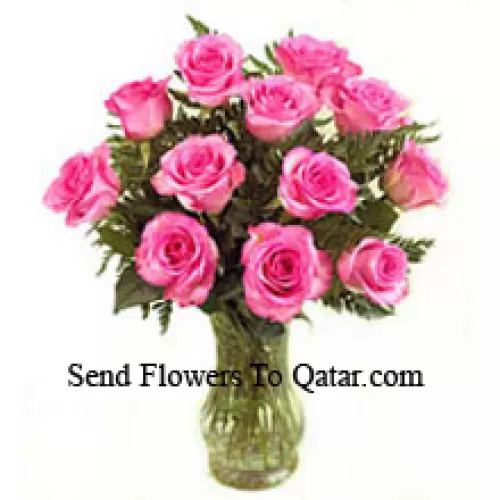 12 Pink Roses With Some Ferns In A Vase