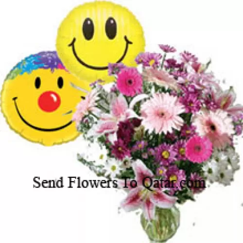 Assorted Flowers In A Vase Along With Smiley Balloons