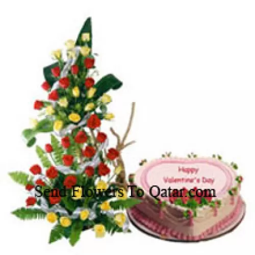 Tall Arrangement Of 100 Red Roses Along With A 1 Kg Heart Shaped Strawberry Cake