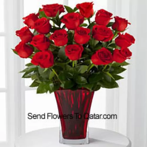 18 Red Roses With Seasonal Fillers In A Glass Vase Decorated With A Pink Bow